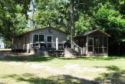 Lakehouse Vacation Rental - Lake Homes for rent on LakeHouseVacations.com, Lake property, Lake House Lake House Oak Haven Lakeside Cottages - Beautiful And Private Lakefront Property, lakeside of cottage, showing deck and screened shelter, on Lake Murvaul in Texas - Lakehouse Vacation Rental - Lake Home for rent on LakeHouseVacations.com