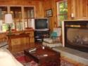 Lakehouse Vacation Rental - Lake Homes for rent on LakeHouseVacations.com, Lake property, Lake House Lake House Lakefront Adirondack Vacation Rental, Living room with gas fireplace, on Long Pond in New York - Lakehouse Vacation Rental - Lake Home for rent on LakeHouseVacations.com