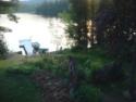 Lakehouse Vacation Rental - Lake Homes for rent on LakeHouseVacations.com, Lake property, Lake House Lake House Lakefront Adirondack Vacation Rental, View of the dock from screened in porch, on Long Pond in New York - Lakehouse Vacation Rental - Lake Home for rent on LakeHouseVacations.com