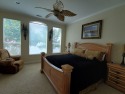 Lakehouse Vacation Rental - Lake Homes for rent on LakeHouseVacations.com, Lake property, Lake House Lake House Rocking L Ranch House On Waterfront, Screened in porch with BBQ grill, fans, lounges, on Cedar Creek Lake in Texas - Lakehouse Vacation Rental - Lake Home for rent on LakeHouseVacations.com