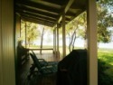 Lakehouse Vacation Rental - Lake Homes for rent on LakeHouseVacations.com, Lake property, Lake House Lake House Cottage On The Lake, Lakefront Cottage Rental, Covered porch to relax and enjoy awesome view of lake, on Lake Tawakoni in Texas - Lakehouse Vacation Rental - Lake Home for rent on LakeHouseVacations.com