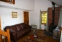 Lakehouse Vacation Rental - Lake Homes for rent on LakeHouseVacations.com, Lake property, Lake House Lake House Few Weeks Left For Summer 2017, Living room w/woodstove, propane heater, view of 2nd story hallway, on Sand Pond Road in Maine - Lakehouse Vacation Rental - Lake Home for rent on LakeHouseVacations.com