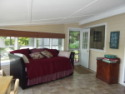 Lakehouse Vacation Rental - Lake Homes for rent on LakeHouseVacations.com, Lake property, Lake House Lake House The Lake House, Sleeping porch with view of Day Bed with twin trundle., on Billings Lake in Connecticut - Lakehouse Vacation Rental - Lake Home for rent on LakeHouseVacations.com