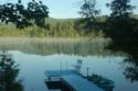 Lakehouse Vacation Rental - Lake Homes for rent on LakeHouseVacations.com, Lake property, Lake House Lake House Lakefront Adirondack Vacation Rental, View of the private dock from the house, on Long Pond in New York - Lakehouse Vacation Rental - Lake Home for rent on LakeHouseVacations.com
