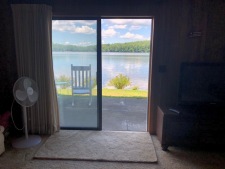 Lakehouse Vacation Rental - Lake Homes for rent on LakeHouseVacations.com, Lake property, Lake House Lake House So. Nh Lakefront 2 Br Rental Swim, Boat And Water Ski!, Glass Sliding Door out to the Pond, on Little Island Pond in New Hampshire - Lakehouse Vacation Rental - Lake Home for rent on LakeHouseVacations.com