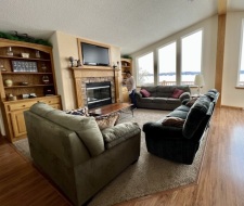 Lakehouse Vacation Rental - Lake Homes for rent on LakeHouseVacations.com, Lake property, Lake House Lake House Lake Front Home (sleeps 19), Living area with lake views, a fireplace, and a TV/Wifi. , on Lewis And Clark Lake in Nebraska - Lakehouse Vacation Rental - Lake Home for rent on LakeHouseVacations.com