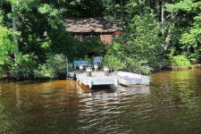 Lake House Secluded Lakeside Split-log Cottage With Fireplace, Rowboat, Cottage and dock., on Lake Horace in New Hampshire - Lakehouse Vacation Rental - Lake Home for rent on LakeHouseVacations.com