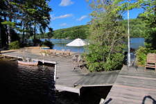 Lake House Secluded, Lakeside, Split-log Cottage With Fireplace, Rowboat, Beach viewed from diving board., on Lake Horace in New Hampshire - Lakehouse Vacation Rental - Lake Home for rent on LakeHouseVacations.com