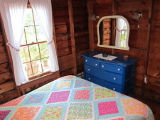 Lake House Secluded, Lakeside, Split-log Cottage With Fireplace, Rowboat, Master bedroom., on Lake Horace in New Hampshire - Lakehouse Vacation Rental - Lake Home for rent on LakeHouseVacations.com