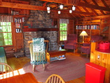 Lake House Secluded Lakeside Split-log Cottage With Fireplace, Rowboat, Greatroom viewed from dining area., on Lake Horace in New Hampshire - Lakehouse Vacation Rental - Lake Home for rent on LakeHouseVacations.com