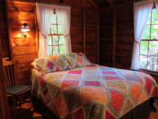 Lake House Secluded Lakeside Split-log Cottage With Fireplace, Rowboat, Master bedroom., on Lake Horace in New Hampshire - Lakehouse Vacation Rental - Lake Home for rent on LakeHouseVacations.com