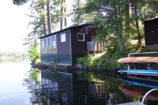 Lake House Waterfront Cottages *private Dock* Mountain Views* Sleeps 8* Seasonal, From dock, back of Lakeside cabin, note the outdoor shower and kayak rack, on Lake Fairlee in Vermont - Lakehouse Vacation Rental - Lake Home for rent on LakeHouseVacations.com