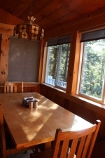 Lake House Waterfront Cottages *private Dock* Mountain Views* Sleeps 8* Seasonal, Alpine dining area (bench hidden, seats 6 or 7)  Kitchen island seats 2, on Lake Fairlee in Vermont - Lakehouse Vacation Rental - Lake Home for rent on LakeHouseVacations.com