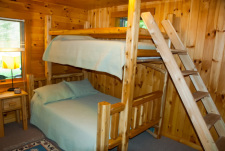 Lakehouse Vacation Rental - Lake Homes for rent on LakeHouseVacations.com, Lake property, Lake House Lake House Log House Maine Lake Shore Boats Fishing Swim Spa, Garden level bedroom; artisan-made bunk with full & twin size beds. Large room, lake view., on Sand Pond in Maine - Lakehouse Vacation Rental - Lake Home for rent on LakeHouseVacations.com