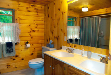 Lakehouse Vacation Rental - Lake Homes for rent on LakeHouseVacations.com, Lake property, Lake House Lake House Log House Maine Lake Shore Boats Fishing Swim Spa, Large bathroom with tub/shower on upper level. Two bedrooms on this level., on Sand Pond in Maine - Lakehouse Vacation Rental - Lake Home for rent on LakeHouseVacations.com