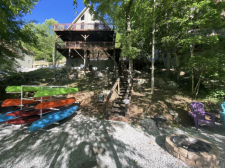 Lake House Shore To Please - Lakefront Rental Cabin, Covered Dock, Firepit, 5 Bds, 3.5 Ba, More, Kayaks and firepit landing near the dock, on Norris Lake in Tennessee - Lakehouse Vacation Rental - Lake Home for rent on LakeHouseVacations.com