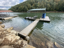 Lakehouse Vacation Rental - Lake Homes for rent on LakeHouseVacations.com, Lake property, Lake House Lake House Shore To Please - Lakefront Rental Cabin, Covered Dock, Firepit, 5 Bds, 3.5 Ba, More, Trex decking awaits on the dock - swim safely and relax with peace of mind, on Norris Lake in Tennessee - Lakehouse Vacation Rental - Lake Home for rent on LakeHouseVacations.com