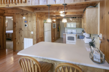 Lake House Shore To Please - Lakefront Rental Cabin, Covered Dock, Firepit, 5 Bds, 3.5 Ba, More, Added seating at the kitchen bar, and view to the main level master , on Norris Lake in Tennessee - Lakehouse Vacation Rental - Lake Home for rent on LakeHouseVacations.com