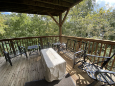 Lakehouse Vacation Rental - Lake Homes for rent on LakeHouseVacations.com, Lake property, Lake House Lake House Shore To Please - Lakefront Rental Cabin, Covered Dock, Firepit, 5 Bds, 3.5 Ba, More, Propane gas fire table added with plenty of lower deck seating and party lights, on Norris Lake in Tennessee - Lakehouse Vacation Rental - Lake Home for rent on LakeHouseVacations.com
