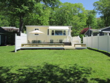 Lake House Newly Renovatored Waterfront With Central Air, Private Dock And Electric Boat, Lakehouse and yard, on Amston Lake in Connecticut - Lakehouse Vacation Rental - Lake Home for rent on LakeHouseVacations.com