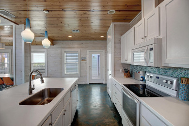 Lake House Lovely home in FABULOUS Village Walk, In-town Gated Community, 2 heated pools, , on Gulf of Mexico - Port Aransas in Texas - Lakehouse Vacation Rental - Lake Home for rent on LakeHouseVacations.com