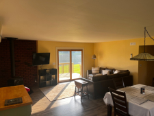 Lake House Charlie's Lakefront Cottage, Warm and inviting dining/living room area, on Lake Shawnee in Pennsylvania - Lakehouse Vacation Rental - Lake Home for rent on LakeHouseVacations.com