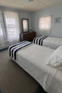 Lakehouse Vacation Rental - Lake Homes for rent on LakeHouseVacations.com, Lake property, Lake House Lake House Cozy Beach Cottage On Charming Lake, Upstairs lake side bedroom, on Klinger Lake in Michigan - Lakehouse Vacation Rental - Lake Home for rent on LakeHouseVacations.com