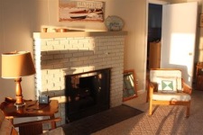 Lakehouse Vacation Rental - Lake Homes for rent on LakeHouseVacations.com, Lake property, Lake House Lake House Cozy Beach Cottage On Charming Lake, Sunset light in living room, on Klinger Lake in Michigan - Lakehouse Vacation Rental - Lake Home for rent on LakeHouseVacations.com