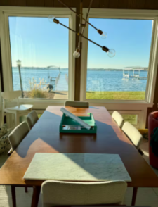 Lakehouse Vacation Rental - Lake Homes for rent on LakeHouseVacations.com, Lake property, Lake House Lake House Wawasee Lakefront Rental - Private Cottage - 60' Of Frontage, Dining table with beautiful lake views, on Lake Wawasee in Indiana - Lakehouse Vacation Rental - Lake Home for rent on LakeHouseVacations.com