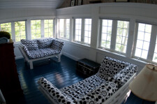 Lake House Secluded Cottage With 120 Foot Private Beach, The sun porch with a 180 degree view of the lake. The futons fold down to sleep two people. , on Cayuga Lake in New York - Lakehouse Vacation Rental - Lake Home for rent on LakeHouseVacations.com