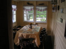 Lake House Lakeside Cottage For Rent On Lake Armington *closed For 2022 Season*, the dining porch which leads to the deck on the water. , on Lake Armington in New Hampshire - Lakehouse Vacation Rental - Lake Home for rent on LakeHouseVacations.com