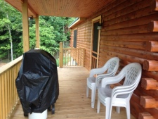 Lakehouse Vacation Rental - Lake Homes for rent on LakeHouseVacations.com, Lake property, Lake House Lake House Southern Cedar Log Cabin New 2015, side deck with grill, on Lake Barkley in Kentucky - Lakehouse Vacation Rental - Lake Home for rent on LakeHouseVacations.com